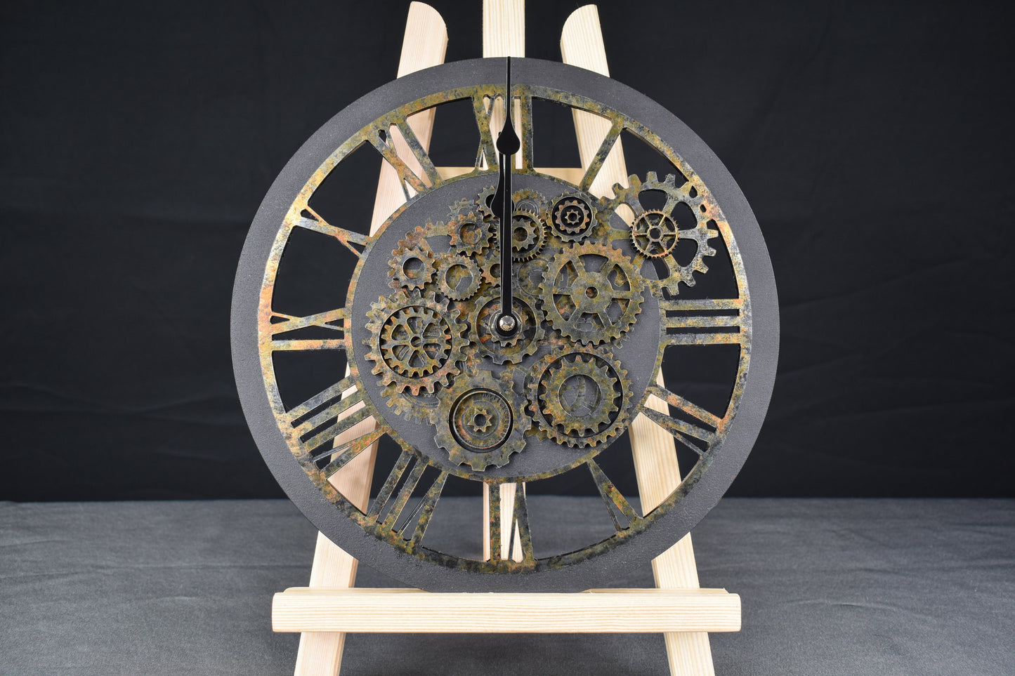 A hand-painted acrylic wall clock with a rusted appearance and Roman numerals, featuring an intricate gear design typical of steampunk aesthetics.