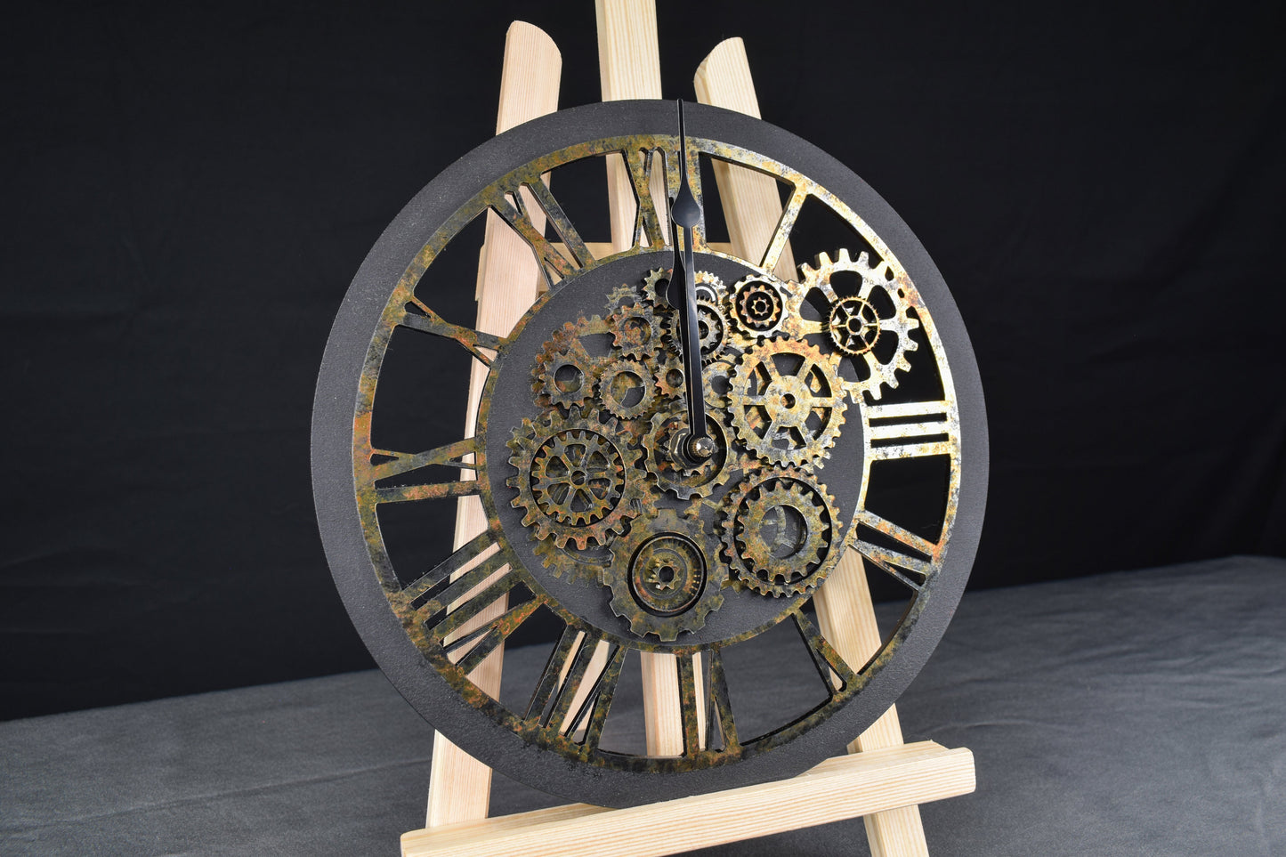A hand-painted acrylic wall clock with a rusted appearance and Roman numerals, featuring an intricate gear design typical of steampunk aesthetics.