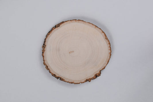 A Basswood wooden coaster displayed against a white background