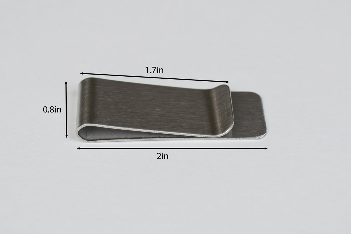 a stainless steel money clip with size markers