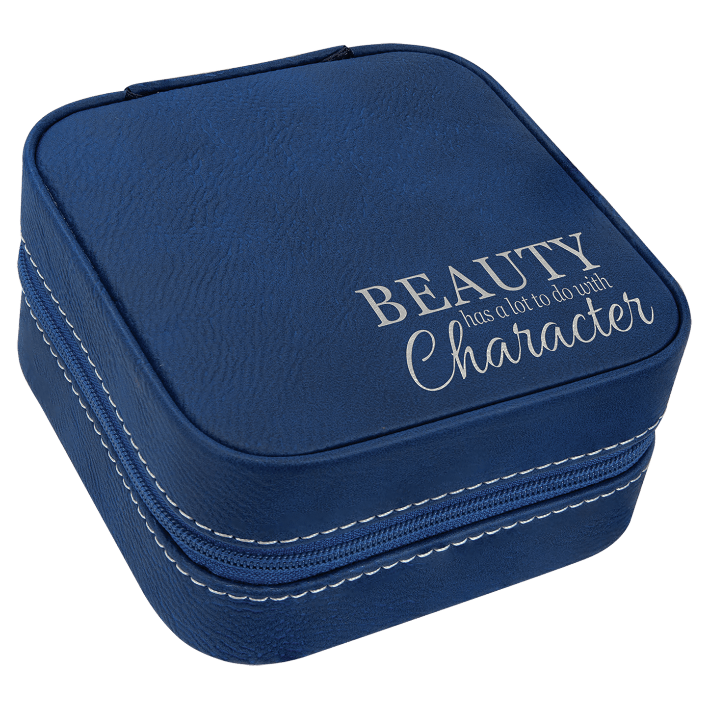 A blue leatherette travel jewelry box featuring a silver laser engraving on the lid that reads 'Beauty has lot to do with character'.