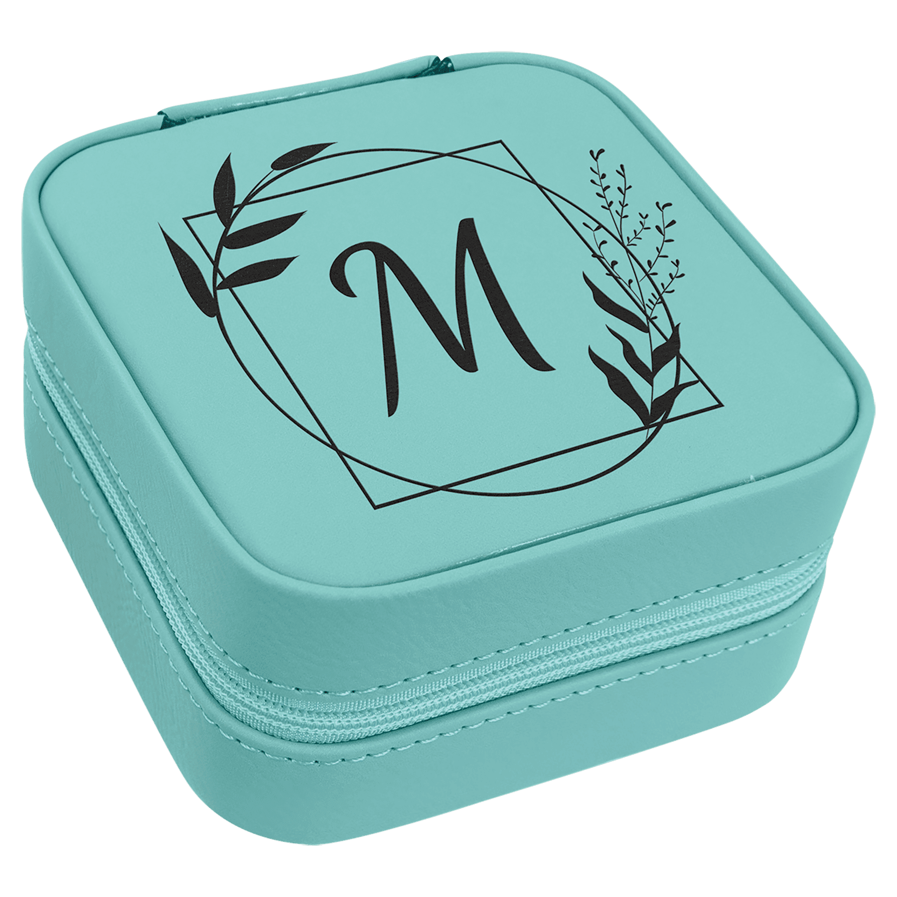 A teal synthetic leatherette travel jewelry box with custom engraving of a letter and leaves on the lid.