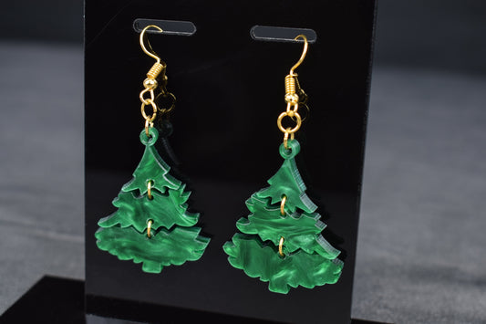 A pair of three-tiered Christmas tree earrings made of dark green swirl acrylic