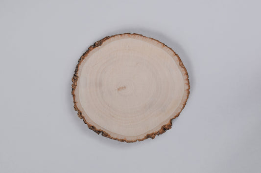 A Basswood wooden coaster displayed against a white background