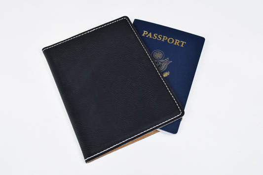 A black synthetic leatherette passport holder with a partially visible passport placed inside