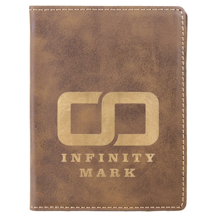 a brown leatherette passport holder with a gold logo laser engraved on the front