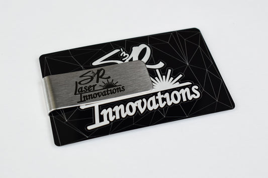 a stainless steel money clip engraved with 's&r laser innovations' logo that is holding an engraved black business card